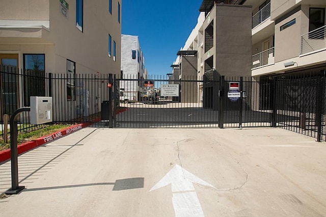 2401 Crawford St Unit A109, Houston, TX 77004 - view of concrete road featuring a gate
