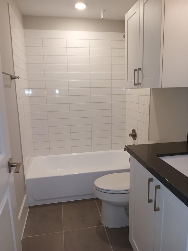 2401 Crawford St Unit A109, Houston, TX 77004 - bathroom featuring vanity, tile patterned floors, washtub / shower combination, and recessed lighting