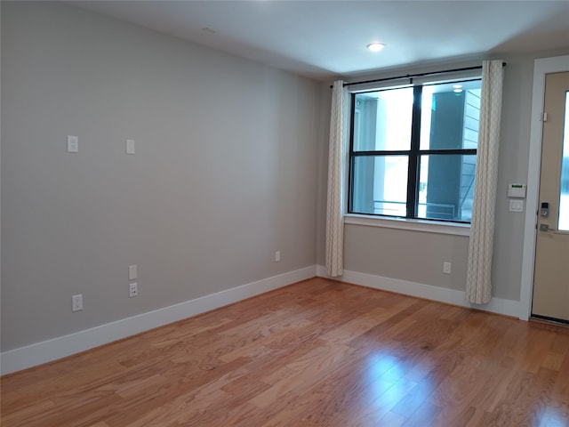 2401 Crawford St Unit A109, Houston, TX 77004 - unfurnished room featuring light wood finished floors and baseboards
