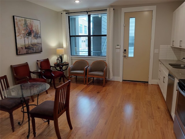 2401 Crawford St Unit A109, Houston, TX 77004 - dining room featuring light wood-style floors