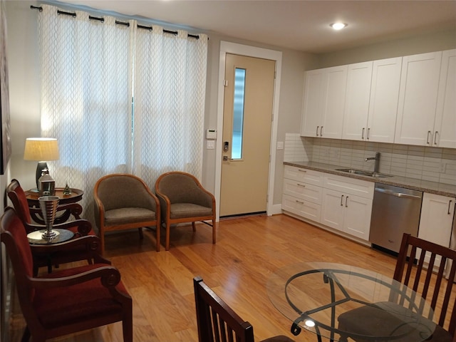 2401 Crawford St Unit A109, Houston, TX 77004 - living area with light wood-style floors and recessed lighting