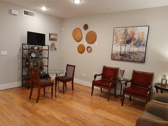 2401 Crawford St Unit A109, Houston, TX 77004 - living area featuring light wood-type flooring and recessed lighting
