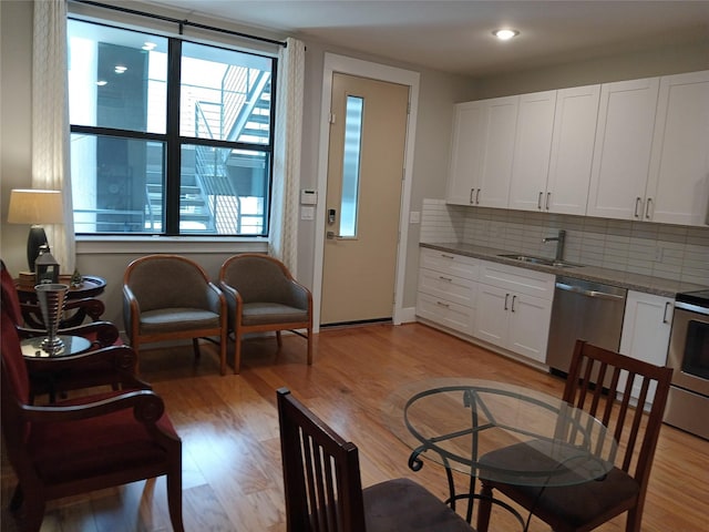 2401 Crawford St Unit A109, Houston, TX 77004 - living room featuring light wood-style flooring and recessed lighting