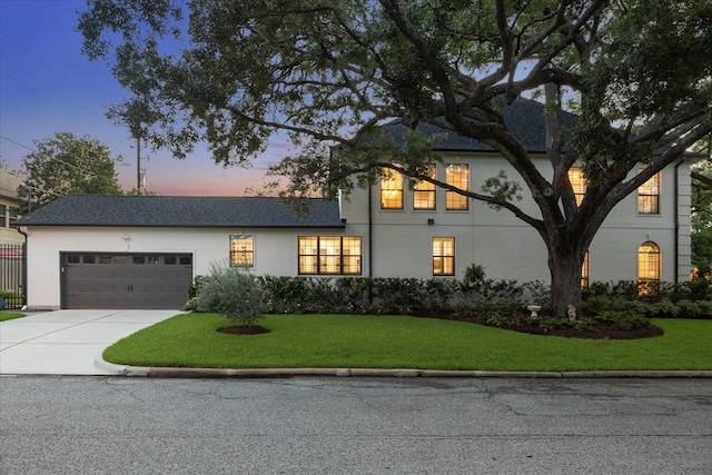 5001 Wedgewood Dr, Bellaire, TX 77401 - view of front of house with an attached garage and driveway