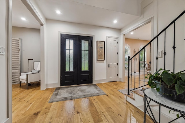 5001 Wedgewood Dr, Bellaire, TX 77401 - foyer entrance with stairway, light wood-style floors, and recessed lighting