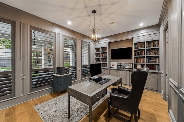 5001 Wedgewood Dr, Bellaire, TX 77401 - office area featuring crown molding, a chandelier, light wood-type flooring, built in features, and recessed lighting