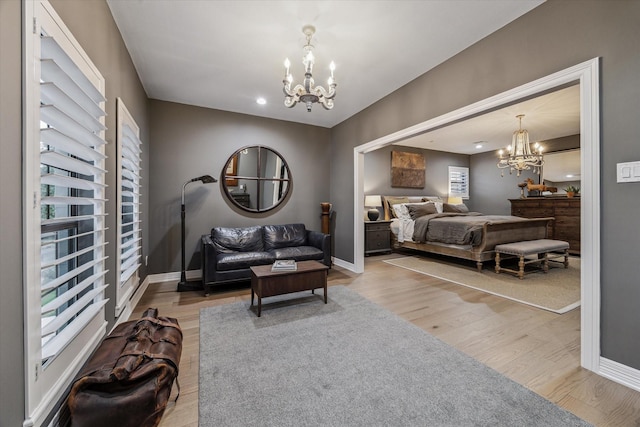 5001 Wedgewood Dr, Bellaire, TX 77401 - bedroom featuring a chandelier, light wood-style floors, and recessed lighting