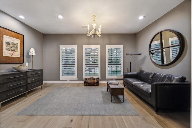 5001 Wedgewood Dr, Bellaire, TX 77401 - living room with a chandelier, light wood-style flooring, and recessed lighting