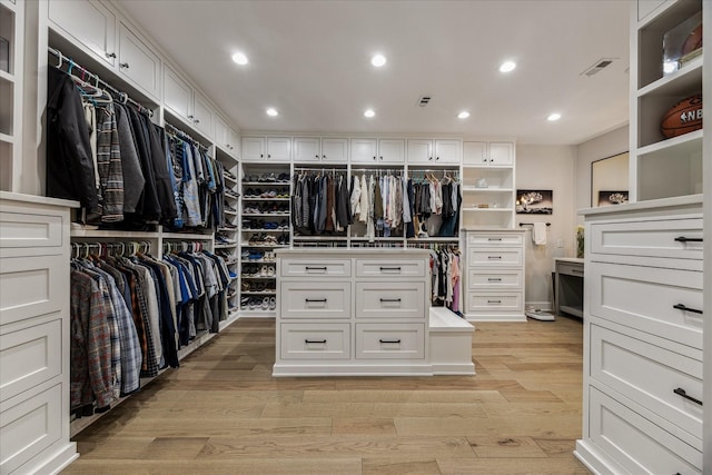 5001 Wedgewood Dr, Bellaire, TX 77401 - walk in closet with light wood-style flooring