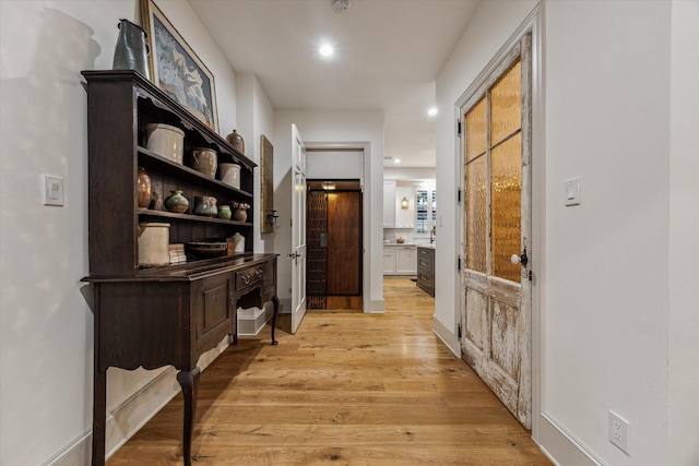 5001 Wedgewood Dr, Bellaire, TX 77401 - hallway with light wood finished floors and recessed lighting