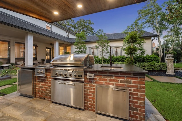 5001 Wedgewood Dr, Bellaire, TX 77401 - view of patio / terrace featuring an outdoor kitchen and a sink
