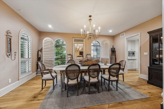 5001 Wedgewood Dr, Bellaire, TX 77401 - dining room with a chandelier, light wood-style floors, and recessed lighting