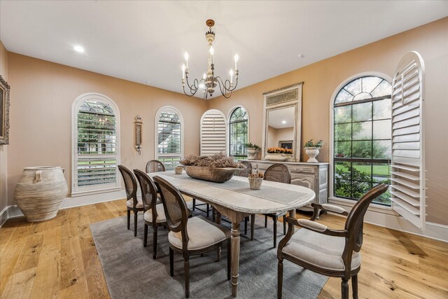5001 Wedgewood Dr, Bellaire, TX 77401 - dining area featuring a chandelier and light wood-style flooring