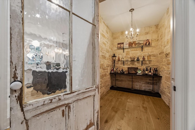5001 Wedgewood Dr, Bellaire, TX 77401 - wine room featuring a chandelier and wood finished floors