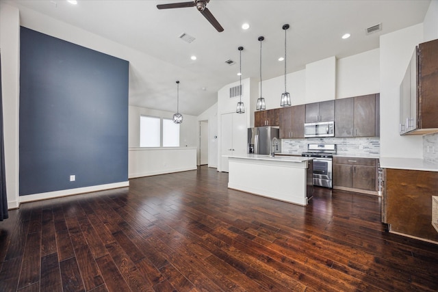 3208 N Macgregor Way Unit C, Houston, TX 77004 - kitchen featuring stainless steel appliances, a ceiling fan, dark brown cabinetry, vaulted ceiling, and backsplash