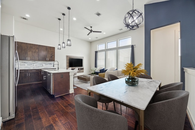 3208 N Macgregor Way Unit C, Houston, TX 77004 - kitchen featuring stainless steel appliances, a ceiling fan, open floor plan, dark brown cabinetry, and dark wood-type flooring