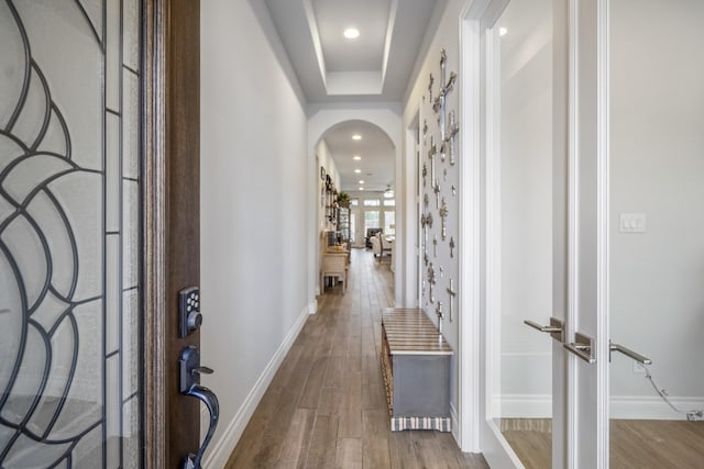 23007 Birchwood Valley Ln, Katy, TX 77493 - foyer featuring wood finished floors, arched walkways, and recessed lighting