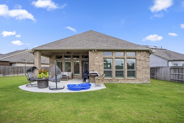 23007 Birchwood Valley Ln, Katy, TX 77493 - rear view of house featuring brick siding, a fenced backyard, a patio, and a ceiling fan