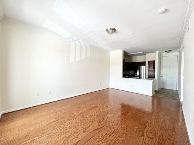 7575 Kirby Dr Unit 1203, Houston, TX 77030 - unfurnished living room with wood finished floors and a skylight