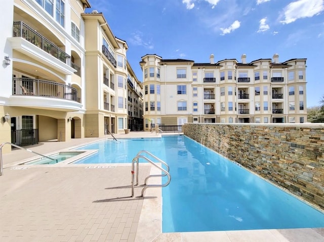 7575 Kirby Dr Unit 1203, Houston, TX 77030 - community pool featuring a patio