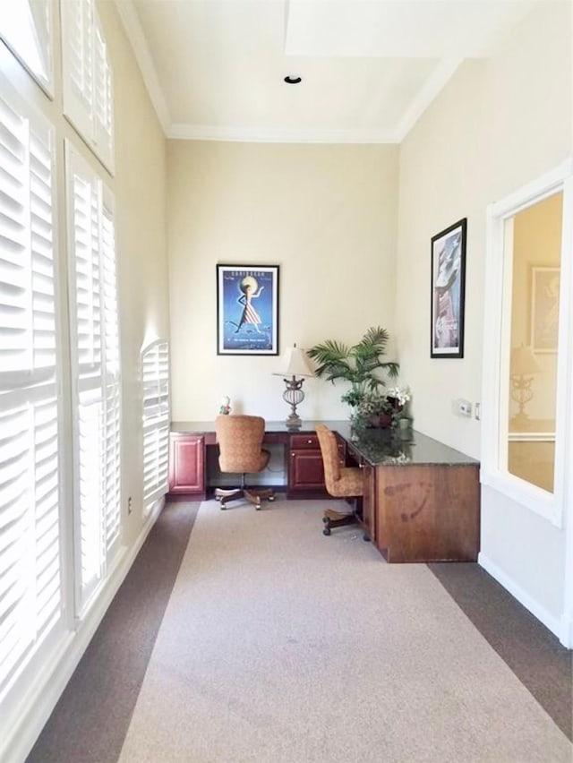 7575 Kirby Dr Unit 1203, Houston, TX 77030 - home office with dark carpet, healthy amount of natural light, and ornamental molding