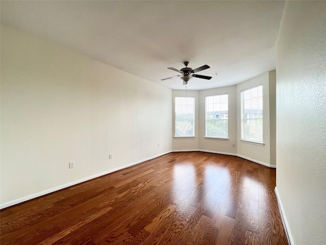 7575 Kirby Dr Unit 1203, Houston, TX 77030 - empty room with wood finished floors and ceiling fan