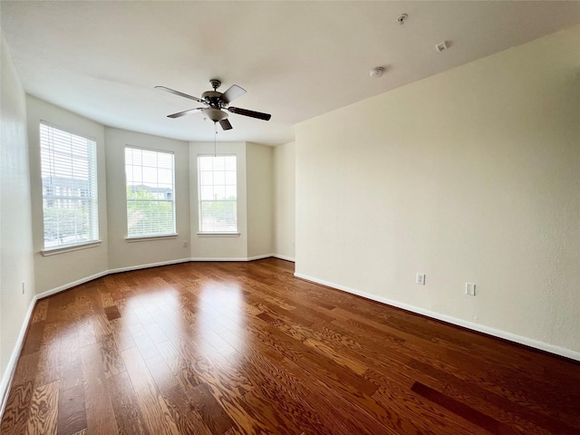 7575 Kirby Dr Unit 1203, Houston, TX 77030 - empty room with ceiling fan, wood finished floors, and a smoke detector
