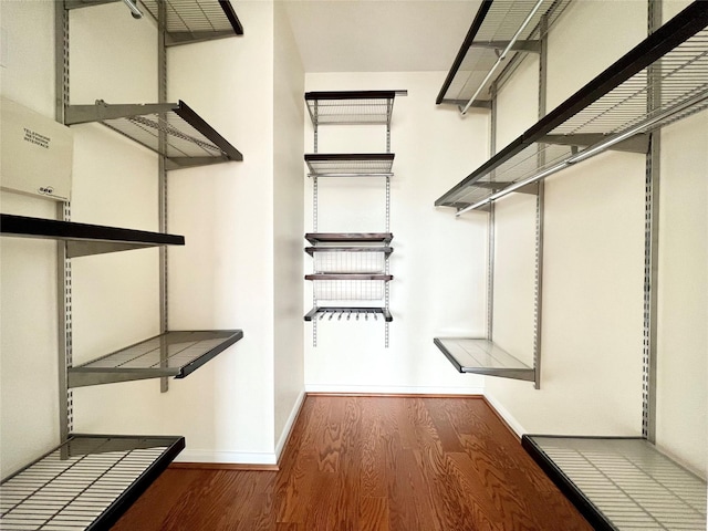 7575 Kirby Dr Unit 1203, Houston, TX 77030 - walk in closet with wood finished floors