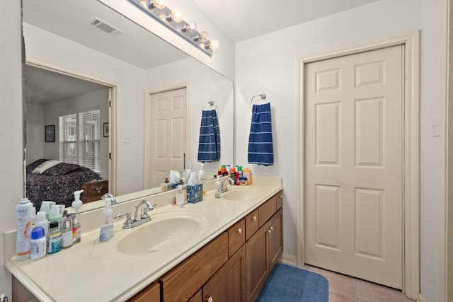 164 Sea Gull Dr, Livingston, TX 77351 - full bath featuring double vanity and tile patterned flooring