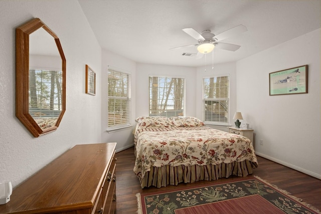 164 Sea Gull Dr, Livingston, TX 77351 - bedroom featuring dark wood-style flooring and a ceiling fan