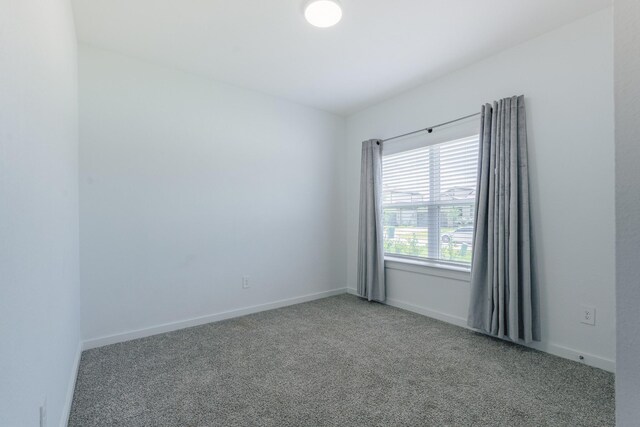 14205 Wonder Lake Ln, Conroe, TX 77384 - unfurnished room with carpet floors and baseboards
