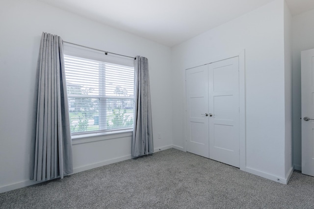 14205 Wonder Lake Ln, Conroe, TX 77384 - unfurnished bedroom with carpet flooring and a closet