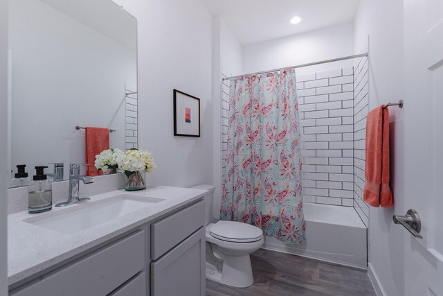 14205 Wonder Lake Ln, Conroe, TX 77384 - full bathroom with vanity, wood finished floors, and shower / bathtub combination with curtain