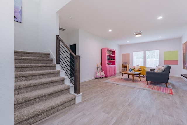 14205 Wonder Lake Ln, Conroe, TX 77384 - living area with stairway, light wood-type flooring, and recessed lighting