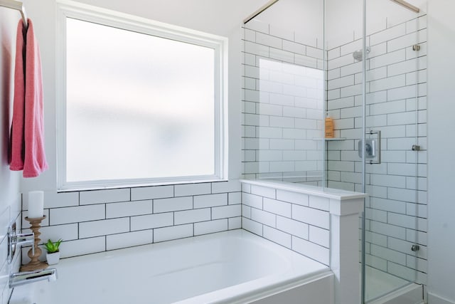 14205 Wonder Lake Ln, Conroe, TX 77384 - full bathroom featuring a shower stall and a garden tub