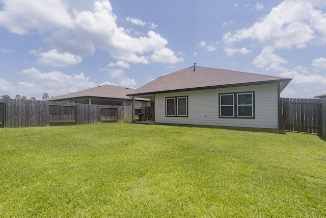 14205 Wonder Lake Ln, Conroe, TX 77384 - rear view of house featuring a fenced backyard and roof with shingles