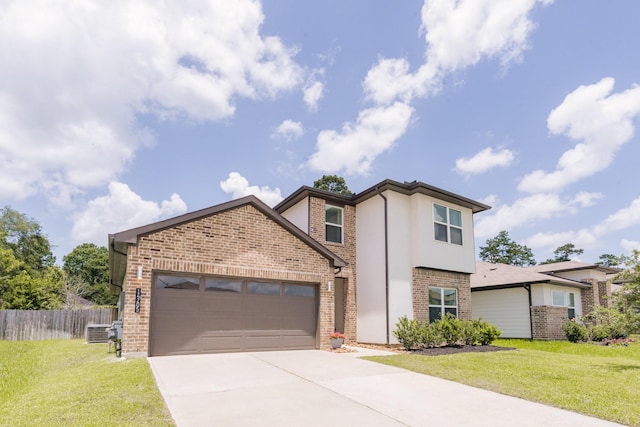 14205 Wonder Lake Ln, Conroe, TX 77384 - traditional-style home with brick siding, an attached garage, concrete driveway, and stucco siding