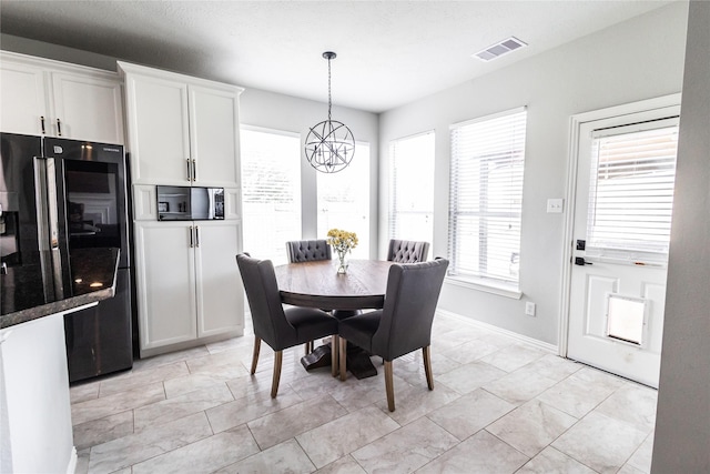 2506 Foxcrest Dr, Katy, TX 77494 - dining area featuring a chandelier and baseboards