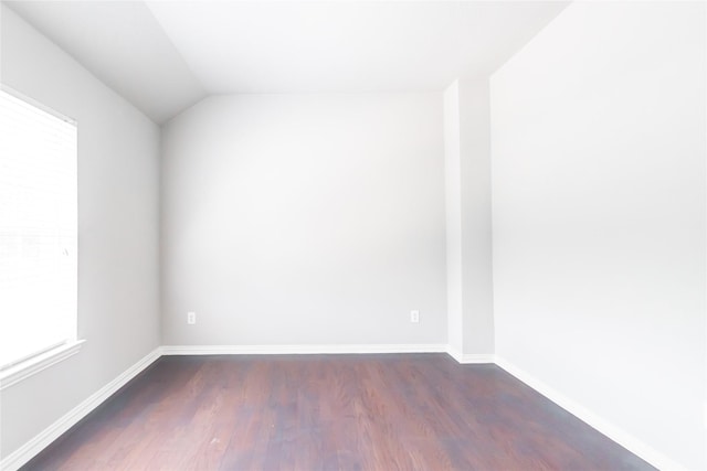 2506 Foxcrest Dr, Katy, TX 77494 - empty room with dark wood finished floors, plenty of natural light, and vaulted ceiling