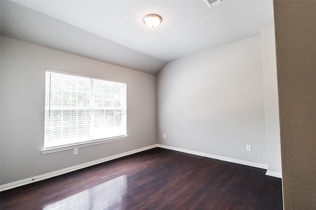 2506 Foxcrest Dr, Katy, TX 77494 - unfurnished room with dark wood-type flooring and lofted ceiling