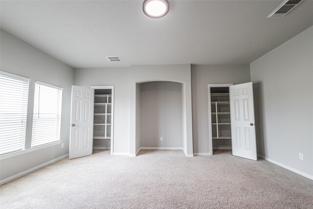 2506 Foxcrest Dr, Katy, TX 77494 - unfurnished bedroom featuring carpet flooring and two closets
