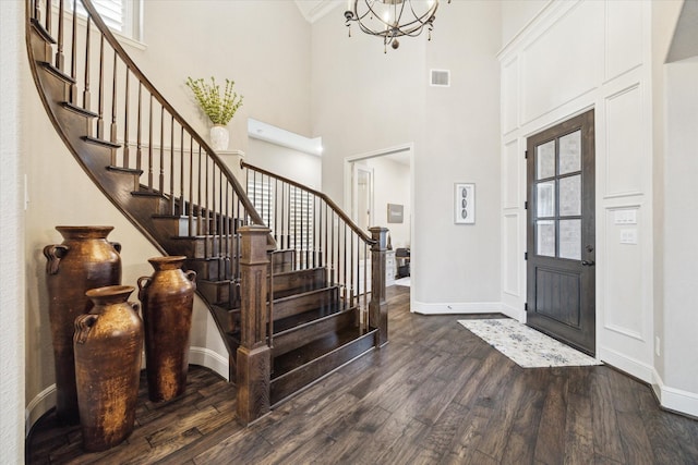 13627 Saddlebred Springs Ln, Cypress, TX 77429 - foyer entrance featuring dark wood finished floors, stairs, a high ceiling, and a chandelier