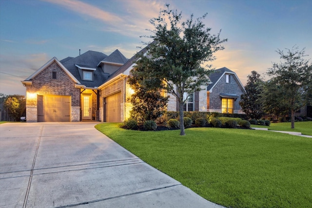 13627 Saddlebred Springs Ln, Cypress, TX 77429 - view of front of house featuring a front yard, an attached garage, brick siding, concrete driveway, and stone siding