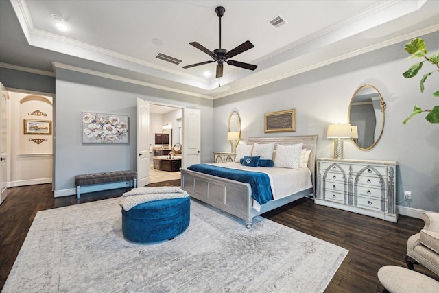 13627 Saddlebred Springs Ln, Cypress, TX 77429 - bedroom featuring a raised ceiling, ornamental molding, wood finished floors, ensuite bathroom, and ceiling fan