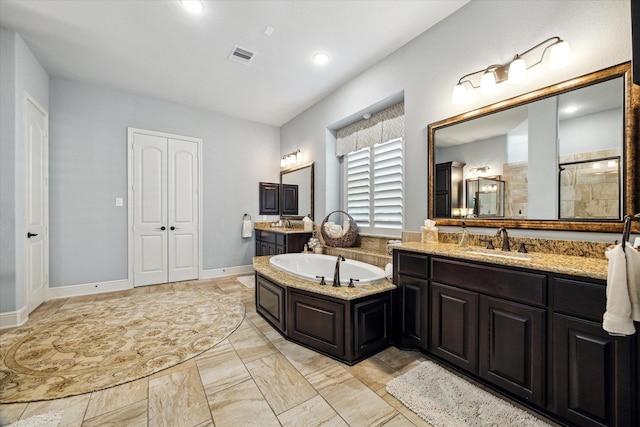 13627 Saddlebred Springs Ln, Cypress, TX 77429 - full bathroom featuring two vanities, a bath, marble finish floors, and a tile shower