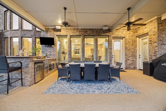 13627 Saddlebred Springs Ln, Cypress, TX 77429 - view of patio / terrace with ceiling fan, area for grilling, an outdoor bar, and outdoor dining area