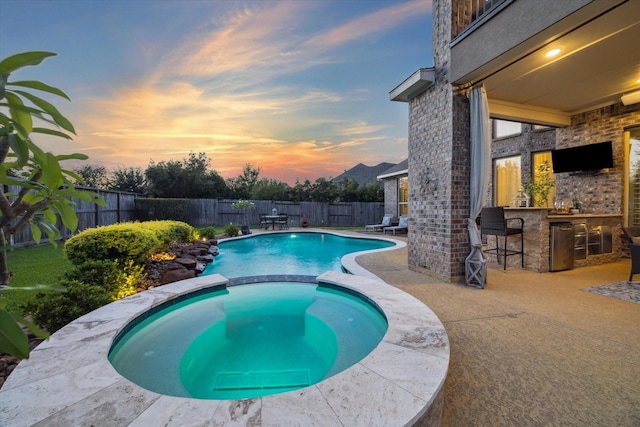 13627 Saddlebred Springs Ln, Cypress, TX 77429 - view of pool featuring a fenced backyard, a pool with connected hot tub, and a patio
