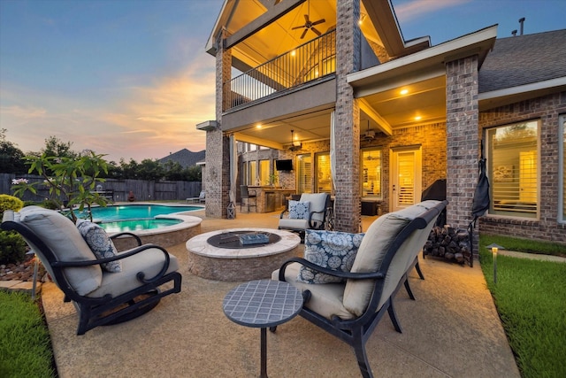 13627 Saddlebred Springs Ln, Cypress, TX 77429 - patio / terrace featuring a patio, a bar, and an outdoor living space with a fire pit