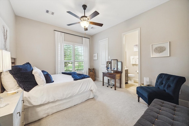 13627 Saddlebred Springs Ln, Cypress, TX 77429 - bedroom with light colored carpet, ensuite bath, and ceiling fan