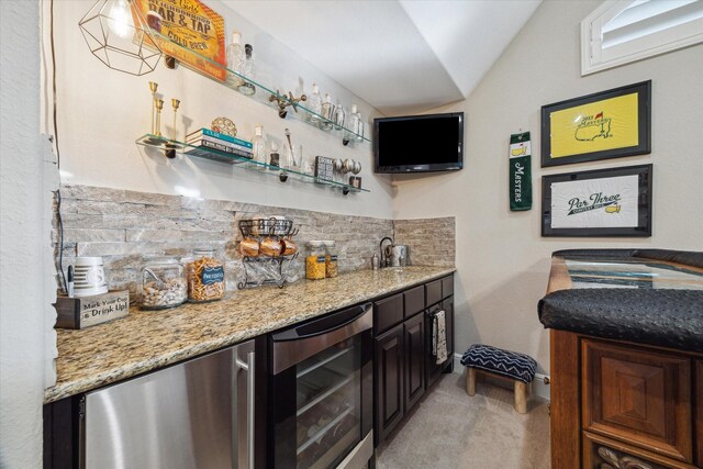 13627 Saddlebred Springs Ln, Cypress, TX 77429 - indoor wet bar with beverage cooler, tasteful backsplash, lofted ceiling, light colored carpet, and fridge